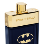 Luxury Men’s Fragrance in a sleek dark bottle, crowned with a golden cap, featuring the iconic Batman emblem on the front
