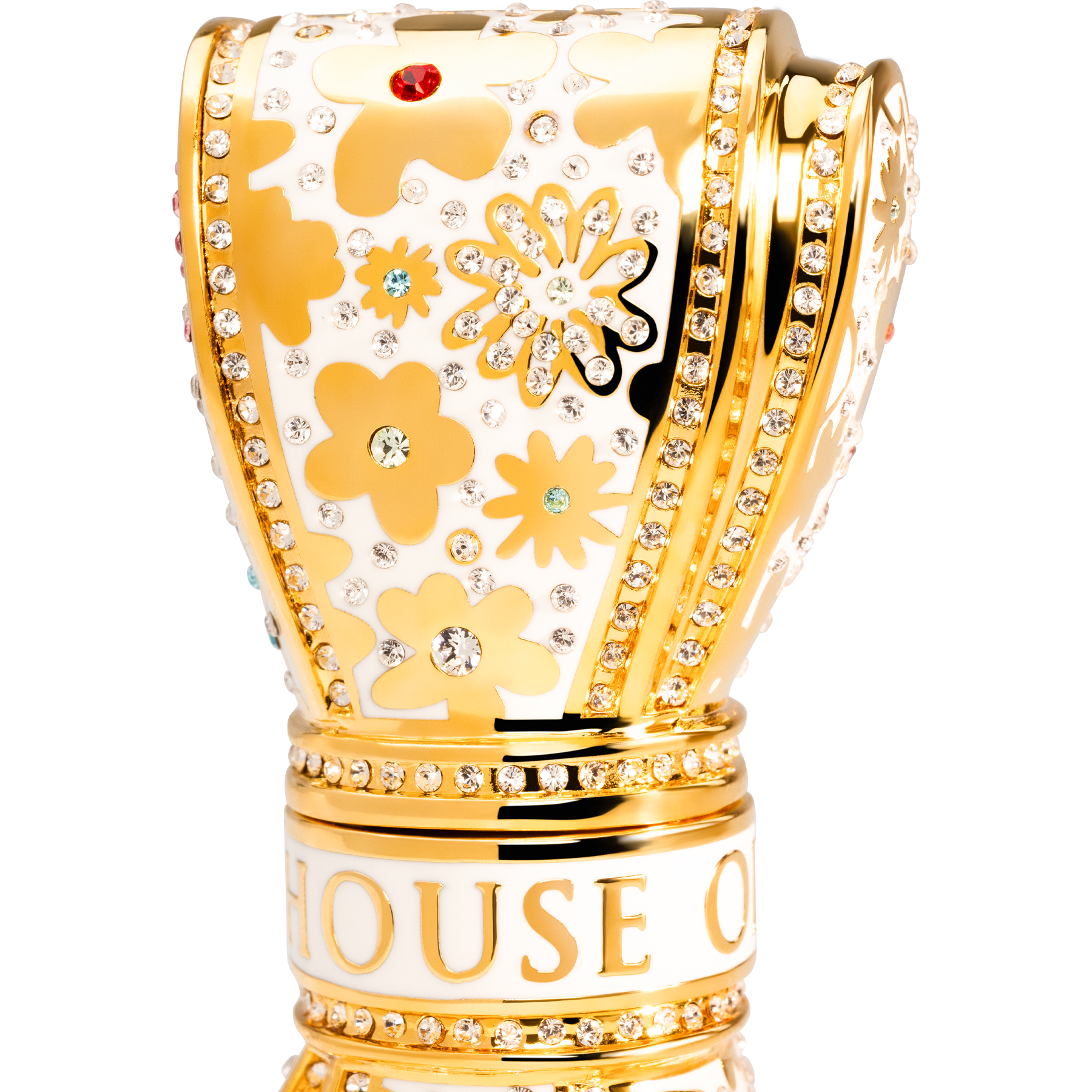 Gold and white decorative  luxury lipstick with floral patterns and 'House of' branding on a white background