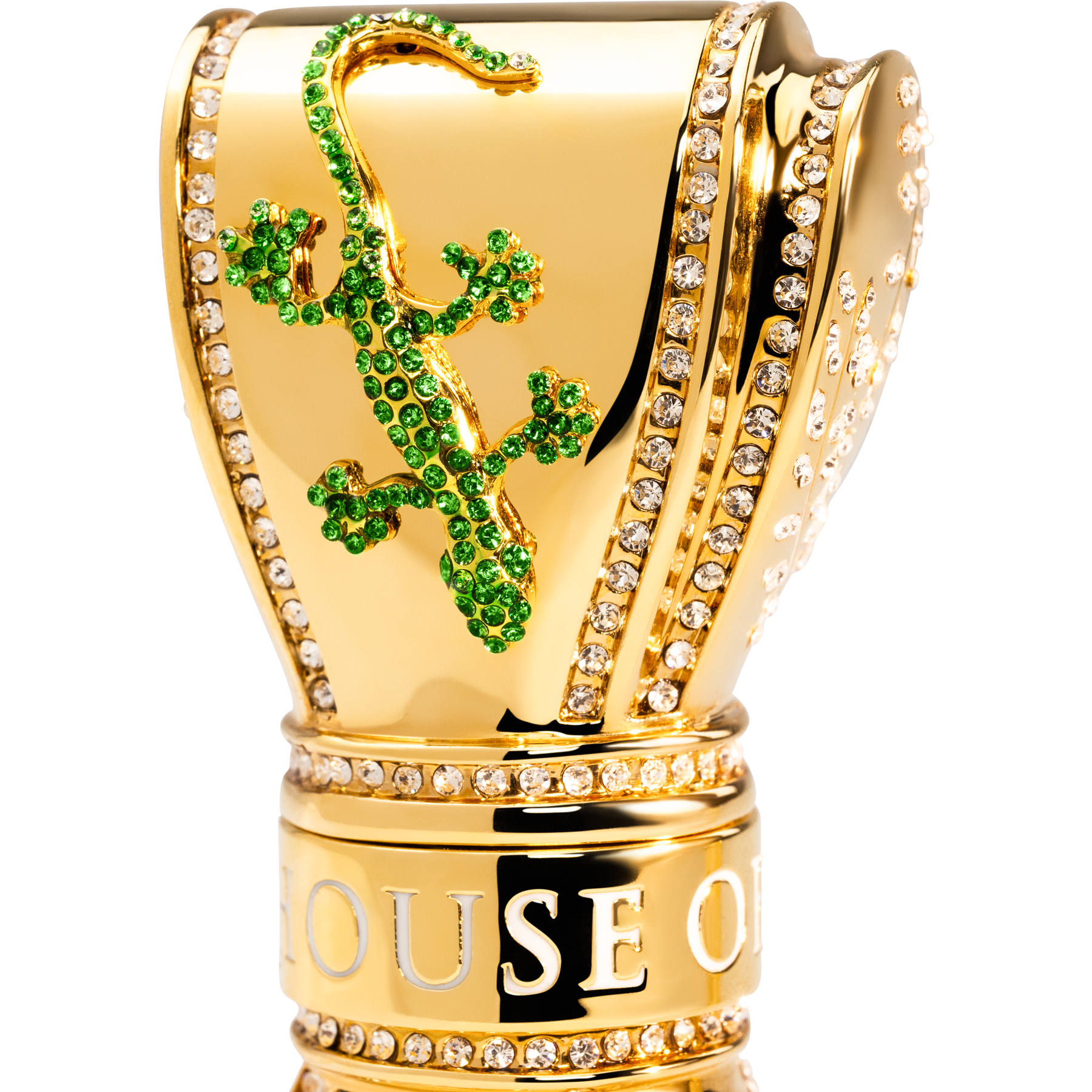 Gold perfume bottle with green gemstone design gecko. 