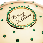 Gold niche fragrance cup  with 'Passion de L'Amour' text and green gemstones